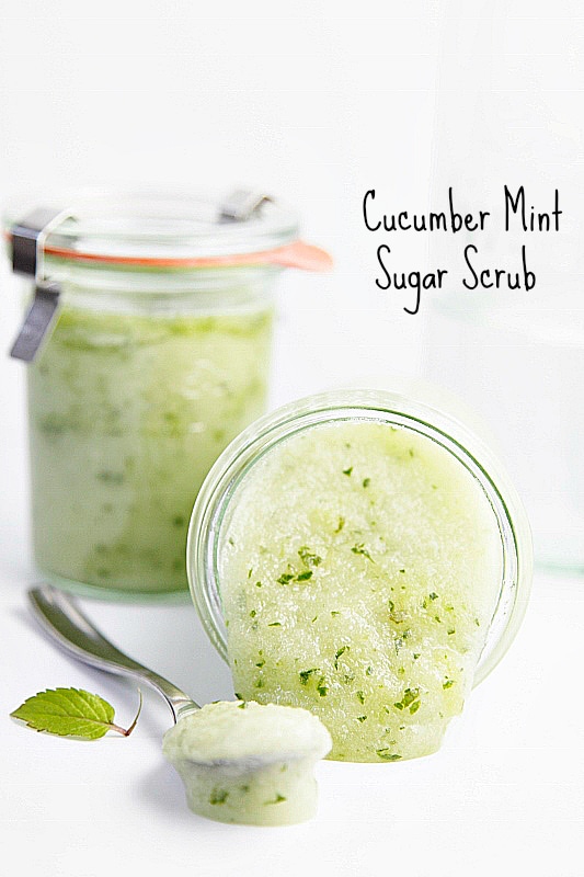 light green cucumber mint scrub in glass jars with a metal spoon