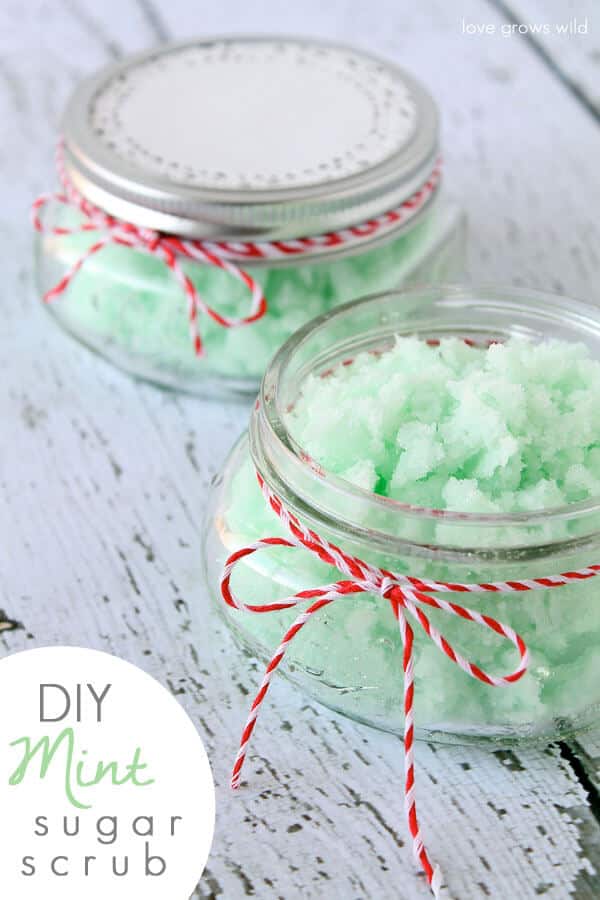 mint green sugar scrub in two jars with red and white twine