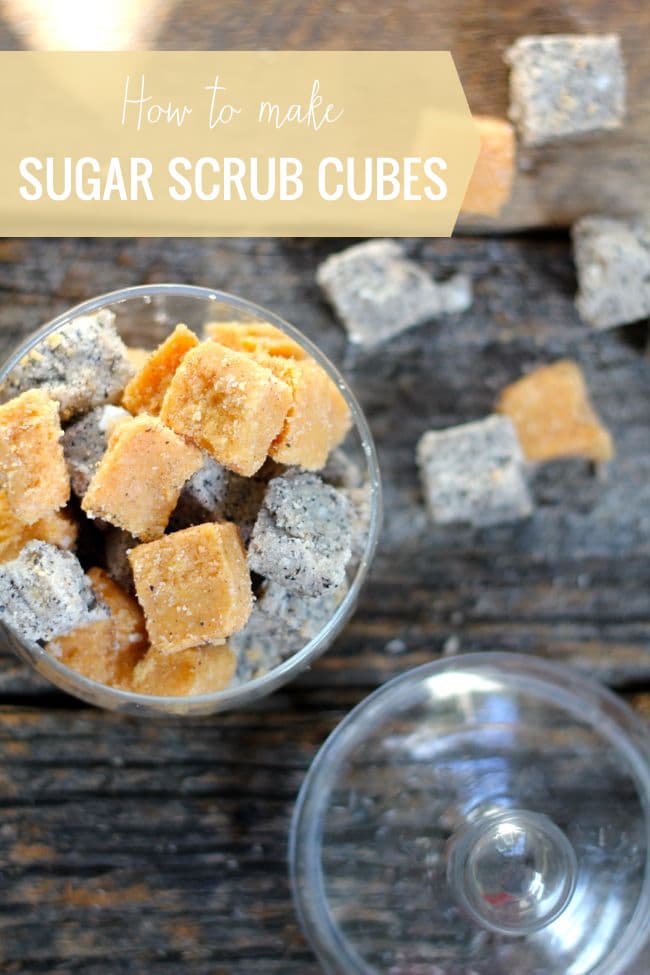 orange and gray sugar scrub cubes in a cup on a wooden table