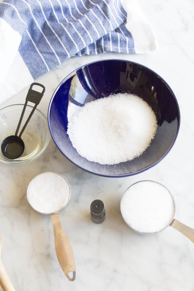 Ingredients for a DIY foot scrub on a marble counter