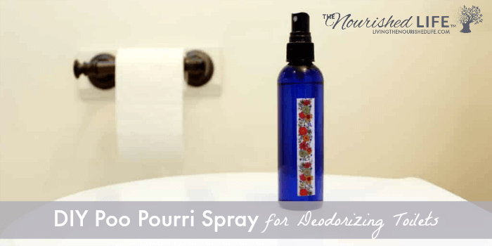DIY Poo Pourri Spray Recipe for Deodorizing Toilets: blue spray bottle on toilet seat
