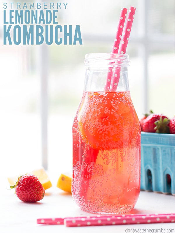 a bottle of fizzy strawberry lemonade kombucha with two pink straws