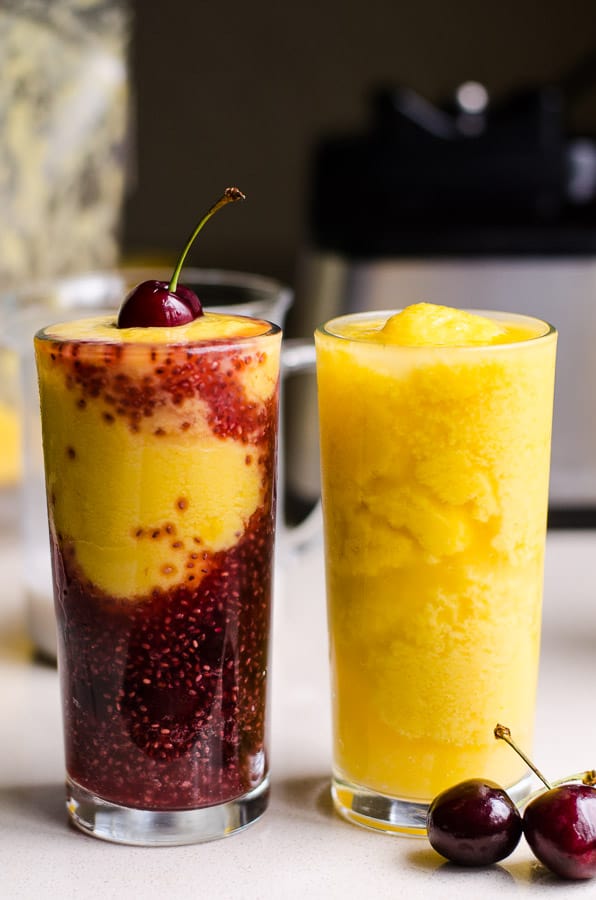 Two glasses of mango cherry kombucha smoothies